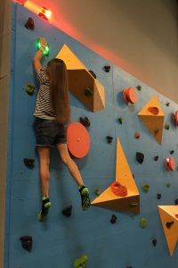 Kid climbing traverse